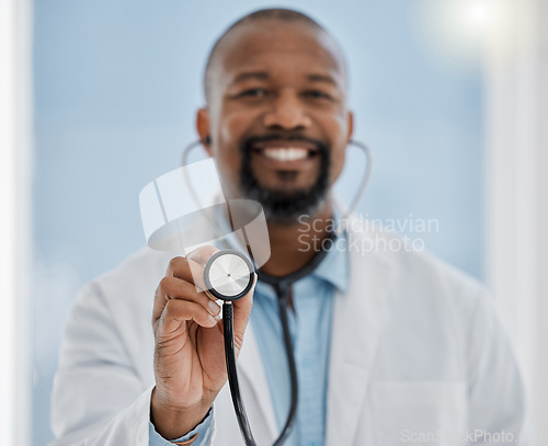 Image of Medical, healthcare worker and doctor with a stethoscope and smile ready for a patient. Hospital, health clinic or professional doctors office worker happy to help check heart health of patients