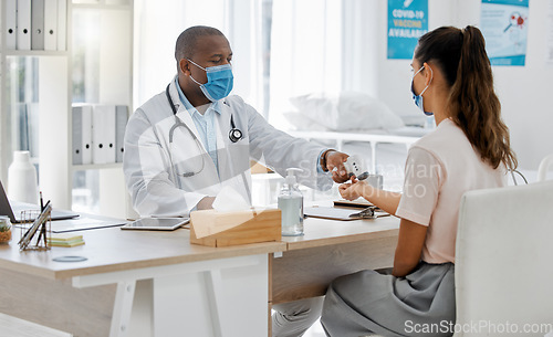 Image of Doctor check fever of sick covid patient to test risk of cold, flu or corona in surgery. Healthcare worker consulting with laser thermometer for virus safety and wellness service in medical hospital