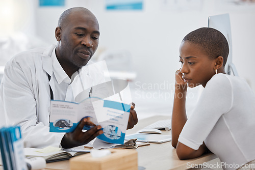 Image of Doctor, brochure and medical patient consulting about health while learning about healthcare at office desk. Man, GP and support communication for woman on safety from virus, disease or sickness.