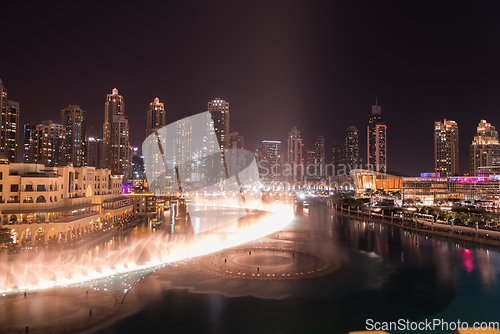 Image of Unique view of Dubai Dancing Fountain show at night.