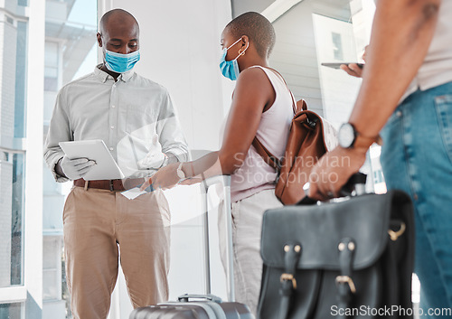 Image of Covid security, passport and immigration at the airport during travel restrictions. Guard or compliance officer checking identity document of traveling woman in the corona virus or covid 19 pandemic