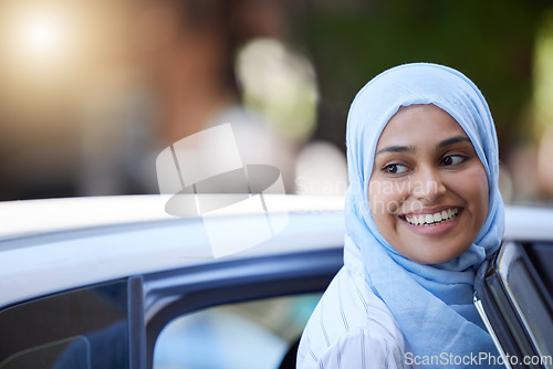 Image of Muslim business woman using car to travel for transport in urban city, thinking of location and happy on work trip. Face of Arab and Islamic worker in taxi cab with smile and working as entrepreneur