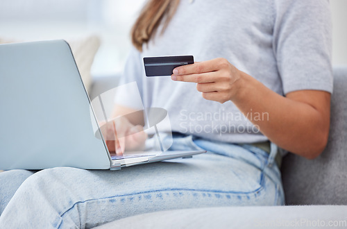 Image of Banking, paying and online shopping with laptop and credit card by a woman at home. Casual female purchasing, buying and ordering products on the web or internet or a website with a app on ecommerce