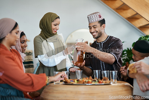 Image of Ramadan, Eid and iftar with a muslim family celebrating breaking of the fast with food and drink at home. Bonding, feeling together and enjoying a traditional islamic feast and holy celebration