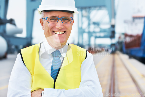 Image of Happy cargo, logistics and shipping manager smile on a port with a factory, warehouse or plant in the background. Manufacturing, supply chain and freight leader in the industrial delivery business