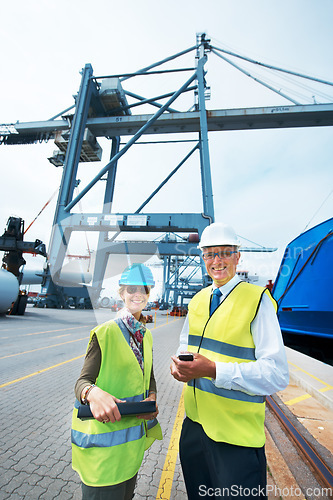 Image of Industry workers working on a shipping dock to export stock packages, boxes or containers. Portrait of industrial, business and shipment employees at a cargo logistics outdoor warehouse with a crane.