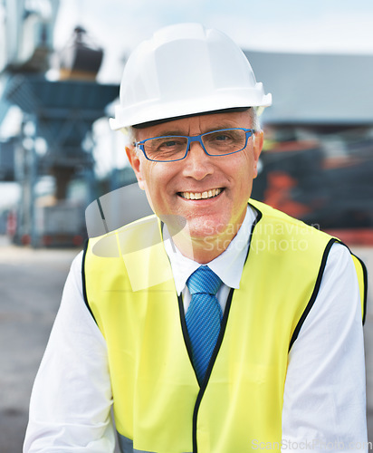 Image of Construction worker, engineer or logistics manager portrait at a shipping warehouse for manufacturing industry. Happy leader man with a vision, goal or mindset for success in cargo industrial company
