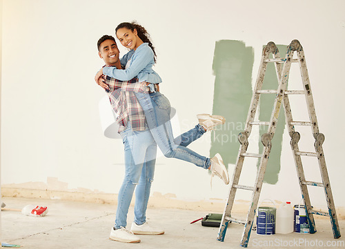 Image of Love, a mortgage and a new home, couple paint a wall in a house green. Security, home finance and investment, a happy marriage and family fun. New beginning and bright future for young man and woman.