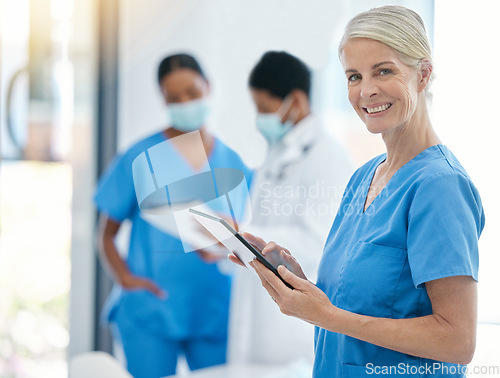 Image of Doctor, smile and medical healthcare professional on tablet for patient records working in hospital building. Trust, consultation and medicine nurse worker with team of health experts