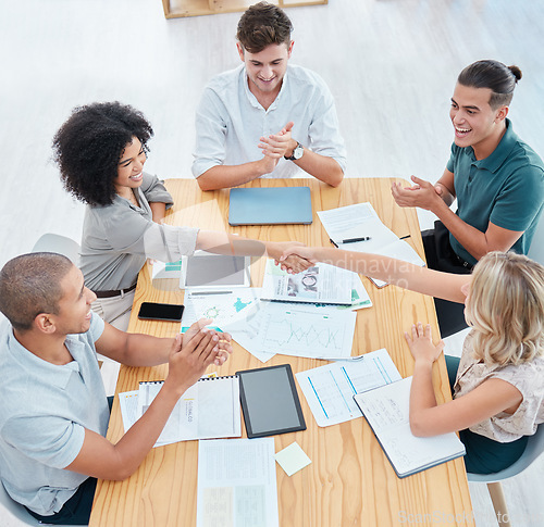 Image of Teamwork, handshake and applause with a team in collaboration and celebration of success in a meeting. Trust, support and wow in the planning of strategy, vision and mission for future growth