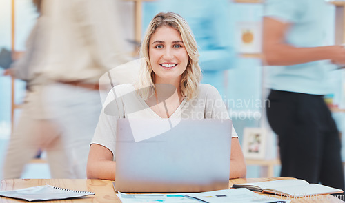 Image of Student doing research on the internet with a laptop at a university class in a building. Portrait of creative woman working or studying for a project with paper and computer in busy library.