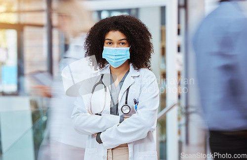 Image of Compliance, healthcare and covid face, mask rules with proud doctor working in a hospital, ready and confident. Health care professional leader work during pandemic, focused on helping sick people