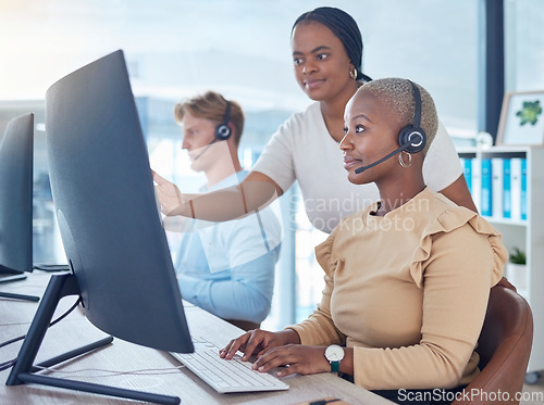 Image of Call center manager coaching sales consultant, telemarketing employee and crm customer service worker with computer software in office agency. Mentor training woman with pc tech solution and strategy