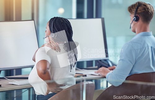 Image of Pain, injury and muscle with a woman call center agent or support staff employee holding her shoulder and back in the office. Anatomy, inflammation and swollen joint from bad posture at work