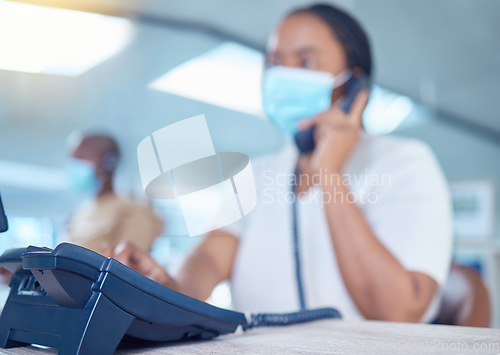Image of Business woman or receptionist on phone call with a mask for covid, corona or virus safety. Company office worker in startup workplace consulting or communication with client about telemarketing sale