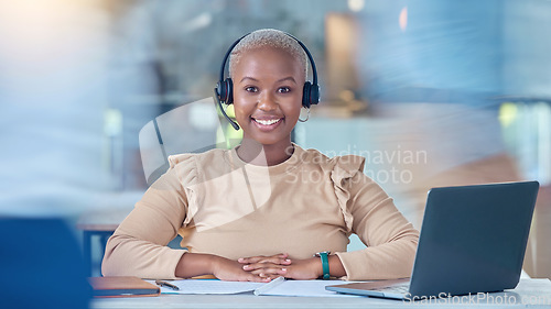 Image of Call center, customer service and contact us support worker with laptop in busy office working on crm consulting. Smile portrait of happy receptionist, telemarketing woman or communication consultant
