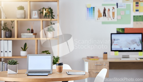 Image of Empty business office interior with a laptop and computer on a desk or table with a professional design. An agency workspace or workplace with equipment connected to the internet or company wifi