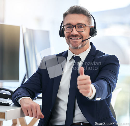 Image of Thumbs up, yes and success deal for a call center agent with contact us and happy about telemarketing. Portrait of a CRM manager or customer service employee smiling due to good business