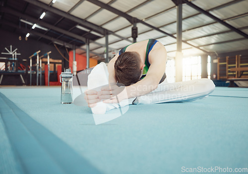 Image of Gymnast man stretching legs at gym with flexibility fitness exercise or workout training for sports competition start. Healthy young sport athlete train for cardio, energy and body performance goal