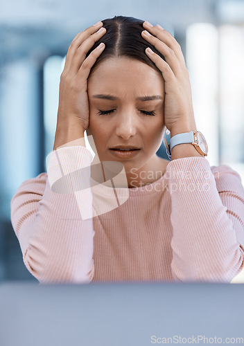 Image of Stressed, tired and sick young woman with a headache feeling sad and overworked in an office. A frustrated, ill and unhappy female employee with a migraine suffering from pain and depression