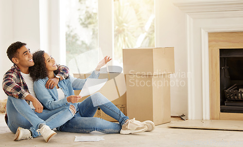 Image of Real estate, house and couple in new home after their property investment and moving in together by boxes on the floor. Interior, smile and young man and woman love investing in residential housing