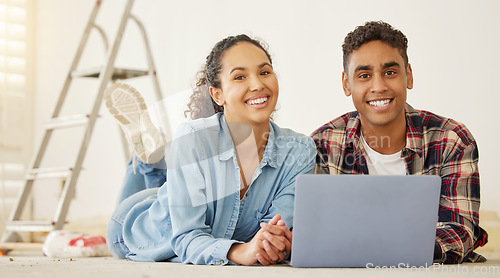 Image of Home, renovation and laptop with a couple working on the internet, looking for an idea with a DIY project and remodel in their house. Portrait of a young man and woman building a domestic addition