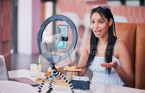 Image of Woman influencer, food review blog and content creator filming online video in cafe restaurant. Creative live streaming, shooting 5g web vlog and virtual mobile phone app broadcast for social media