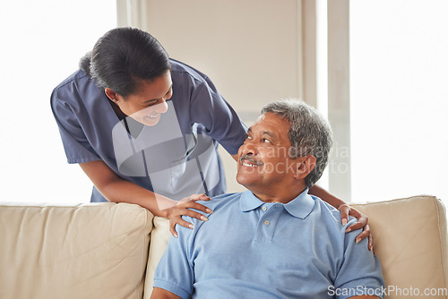 Image of Healthcare, support and nurse working in senior care, bonding with patient showing affection in retirement home. Happy health care worker smiling, caring for mature man in an assisted living facility