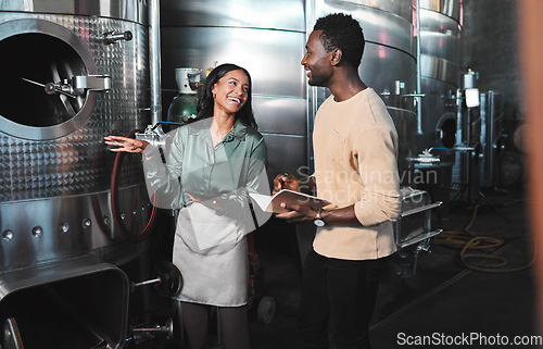 Image of Wine business manufacturing warehouse factory, winery tank cellar brewery warehouse. Happy female winemaker employee at work b2b, ferment grape fruit storage.process and partner company meeting job