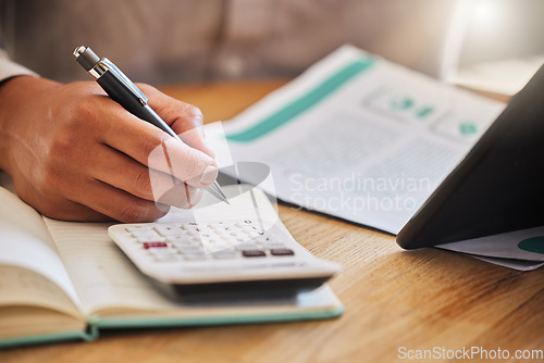 Image of Accountant or financial advisor calculating the tax, expenses or budget for a business in an office. Closeup of male investment consultant hands working and writing company finance statement