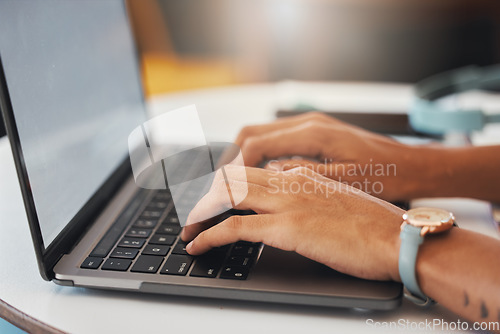 Image of Womans hands typing on a laptop, writing an email or browsing social media and banking. Close up of female hands on a computer looking up stocks, reading the news and working on the online network.