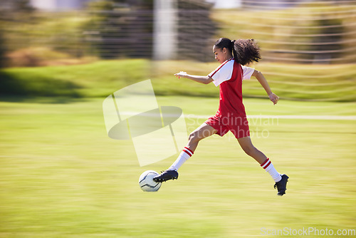 Image of Football, soccer and running girl with a ball doing a sport exercise, workout and training. Moving and young woman athlete in a sports player team uniform runing for fitness cardio on a grass field