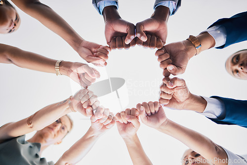 Image of Group of business people, team building hands or fists in a circle in unity. Support, motivation and collaboration in an office partnership. Meeting success in diversity, communication and teamwork.