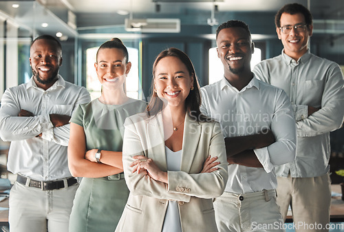 Image of Portrait of team, posing in the office in a business meeting and smiling. Professional ceo, management and employees showing good teamwork with diverse, young and multiracial workers.