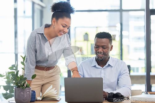 Image of Marketing workers working on a laptop at a office desk in a planning meeting at a startup business. Manager, leader or mentor coaching employee and showing support, collaboration and teamwork at work