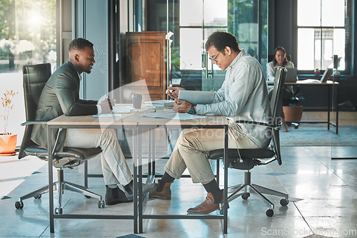 Image of Colleagues, coworkers or male employees collaborating and planning a business growth strategy together in an office. Happy corporate professionals working on a project proposal at a modern workplace