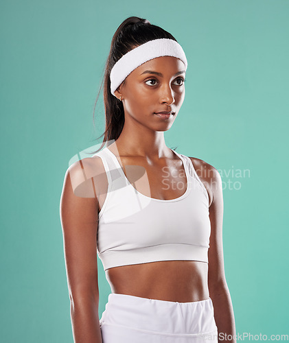 Image of Black female tennis, badminton or squash player standing, relax and cool before competition, tournament and game or match. Athletic and fit African American sports woman with professional sportswear