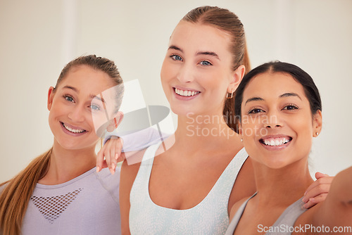 Image of Fun, diverse and sporty friends selfie after routine workout, exercise or training in yoga class or pilates studio. Portrait of smiling, happy or cheerful women bonding, having fun and standing close