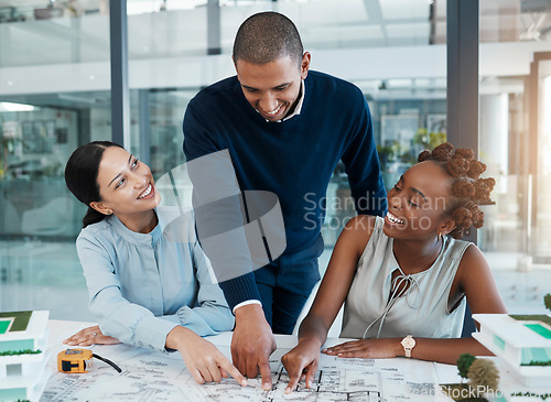 Image of Blueprints, building engineers and architects pointing, showing and smiling in meeting to plan renovation or remodel. Diverse group of designers agreeing and choosing structure design or vision ideas