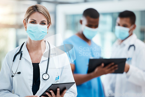 Image of Doctor in covid hospital browsing on tablet for test result, patient records and medical research. Portrait of healthcare professional, phd expert and woman working on treatment cure for flu pandemic