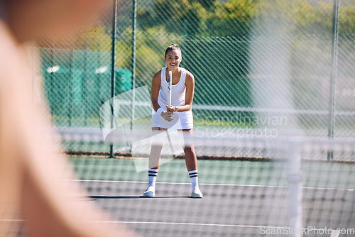 Image of Female tennis player with racket equipment or gear preparing for match at outdoor sport activity from opponent POV. Young athletic or sportswoman standing ready and looking competitive in sportswear