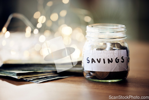 Image of Savings jar, money notes and change of saving for bank investment, retirement and financial safety. Closeup of financial growth after a banking finance budget and spending less to save for the future