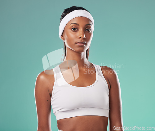 Image of Motivation, focus and success mindset of a woman tennis coach and athlete looking strong. Portrait of a young Indian female sports player ready to start thinking about fitness and exercise training