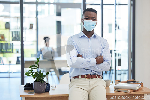 Image of Covid, mask policy and safety in the office workplace with businessman covering his face during quarantine, lockdown or flu season. Leader, manager and professional young man at work in a pandemic.