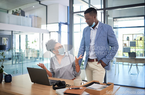 Image of Confused businesswoman with covid face mask asking colleague to cover his face while showing wtf, what and why hand gesture in office. Concerned coworker looking annoyed during quarantine work policy