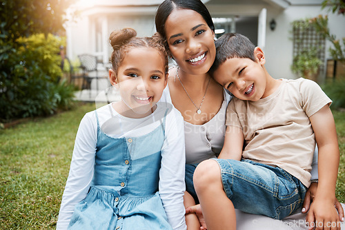 Image of Family bonding, smiling and enjoying new house, garden and backyard as real estate investors, homeowners and buyers. Portrait of single mother, son and daughter with home insurance sitting together