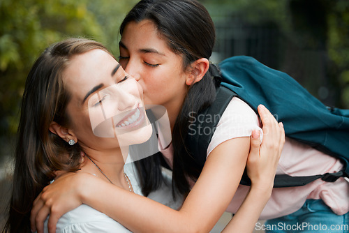 Image of Happy, smiling and young daughter kissing her mother, hugging and greeting before school in the morning. Loving, caring and cheerful parent embracing, holding and giving goodbye hug to little girl