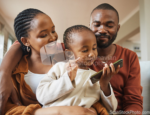 Image of Happy, bonding and family time with a black family on a video call. Young parents being affectionate with their baby while streaming and watching something on a phone, enjoying time with their son