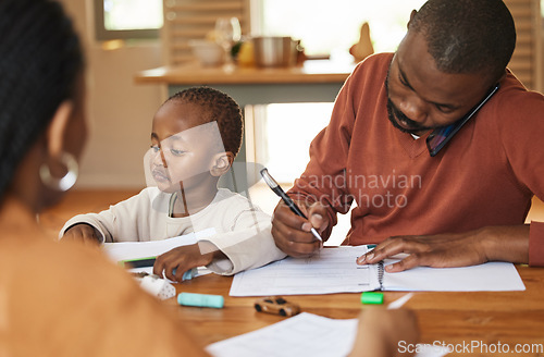 Image of Busy and multitasking father talking on a call while taking care of his child at home. African american entrepreneur or freelancer analyzing paperwork with his wife caring for his busy little son