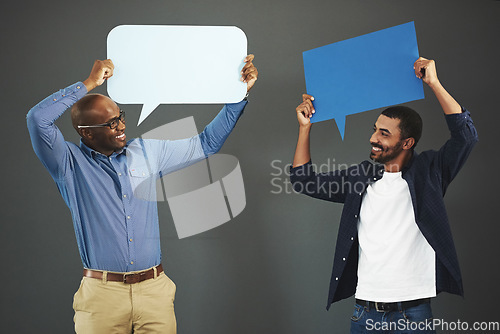 Image of Men holding speech bubbles for social media communication via messaging, chatting and texting. Team of happy, smiling and excited marketing professionals showing networking through online platforms